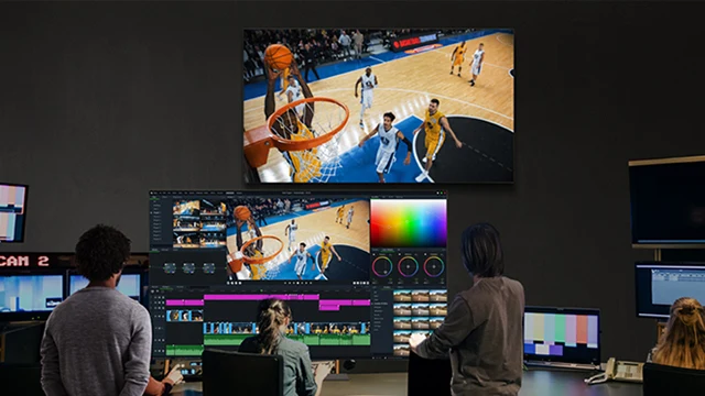 A basketball game broadcast is being monitored on the 65EP5Q, which displays consistent and accurate colors across the entire screen without distortion, regardless of viewing angle.