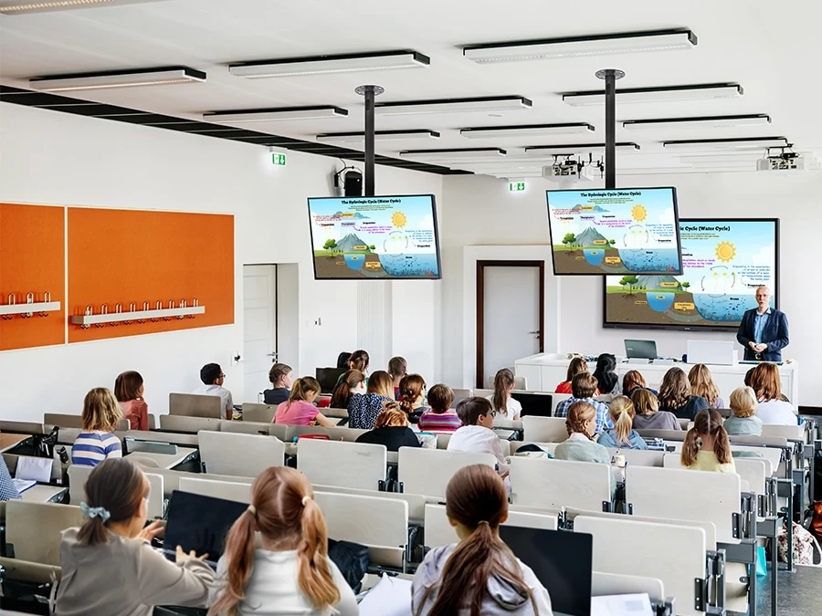 Samsung WAF — In a large classroom filled with students, a central 75-inch WAF display mirrors its educational content onto smaller ceiling-mounted screens, ensuring visibility for all through HDMI connectivity.